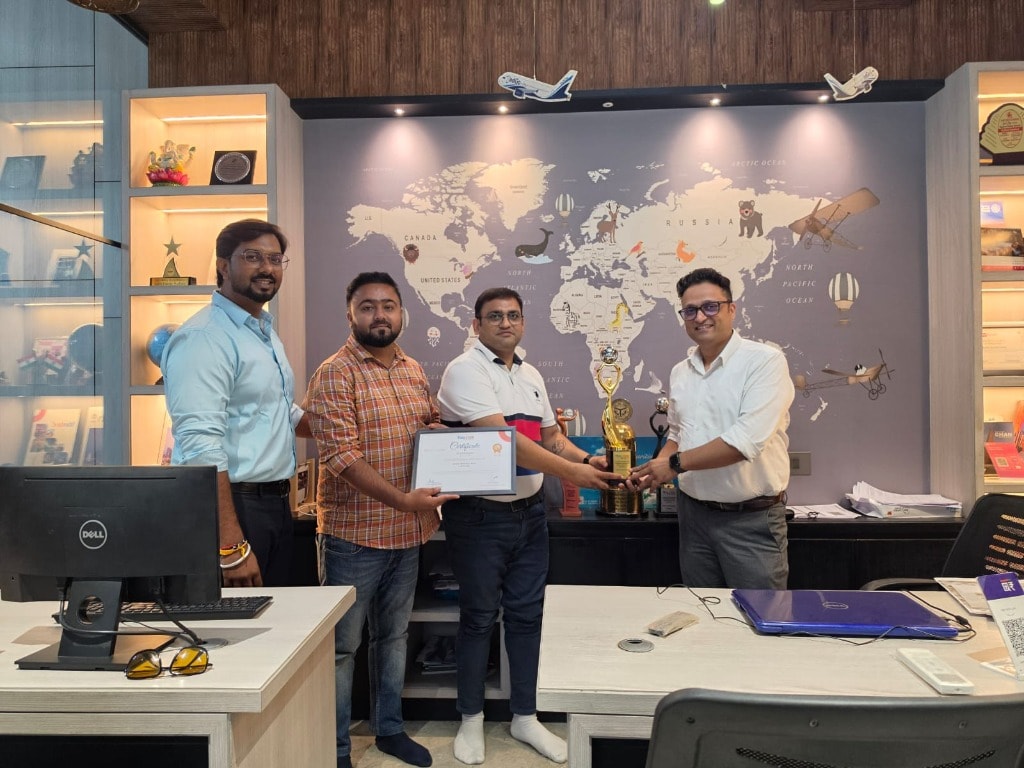 Earth Travels India team receiving TBO.com Gold Award at their Mathura office